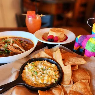 mexican food and drinks on a table