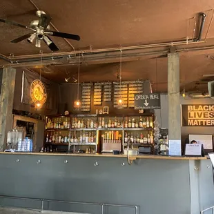 a bar with a ceiling fan