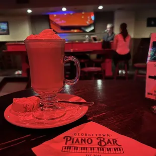 a cup of coffee and a menu