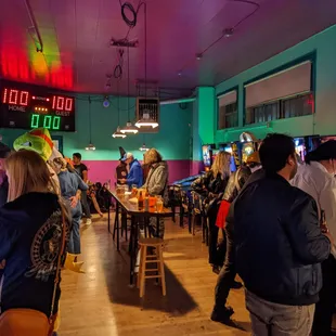 people playing pinball