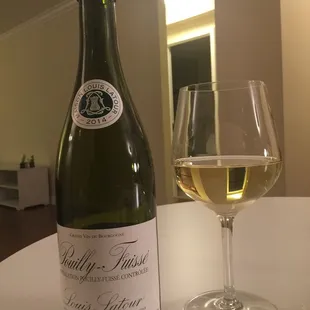 a glass of wine and a bottle of wine