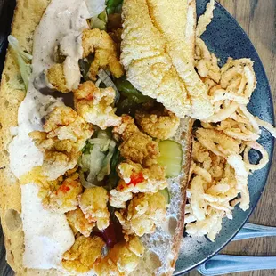 Crawfish and Catfish poboy with onion straws.
