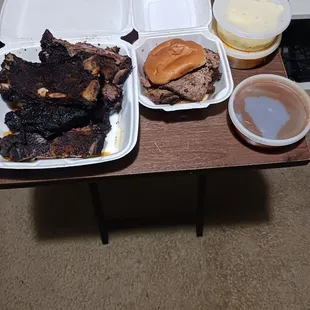 Bbq sauce a brisket sandwich Mac and cheese and beef ribs.