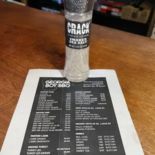 Menu and a bottle of Superior Crack Smoked Sea Salt