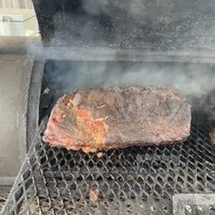 smoke coming out of the grill