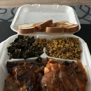 Ribs and chicken with greens and dirty rice.