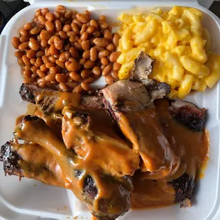 Baked beans, Mac-n-cheese, ribs and chicken in their tangy bbq sauce