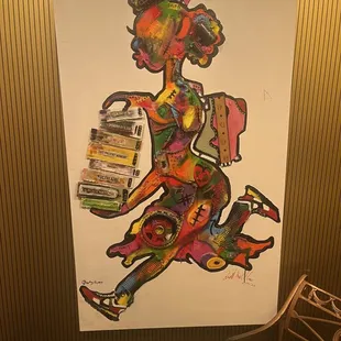 Cute artwork by bathrooms