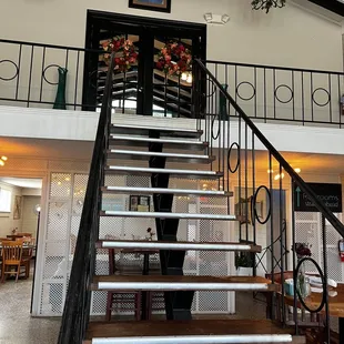 Stairs to second level dining area