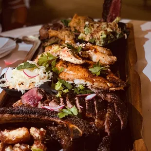 Baller Board - Porterhouse, Fried chicken &amp; dirty rice, Red snapper &amp; crab claws, Ribeye. 3 sides included.