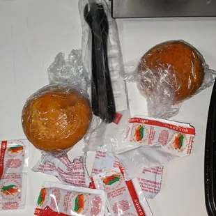 Cornbread , utensils and ketchup and hot sauce packets