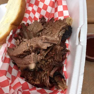 a pulled pork sandwich in a basket