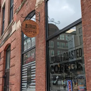 a brick building with a sign on the front