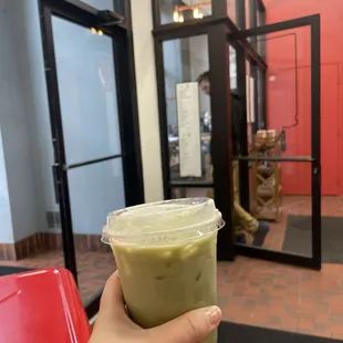 Matcha latte with pistachio, cherry and lavender