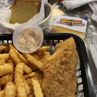 Fried Catfish with fries and hush puppies.