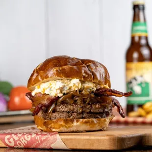 Beer cheese and bacon burger on a locally-baked pretzel bun