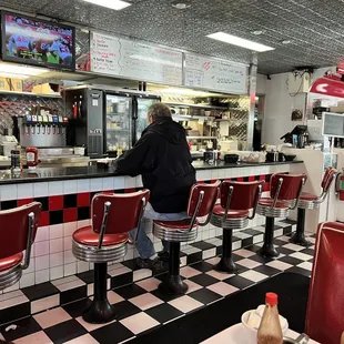 a man sitting at the counter