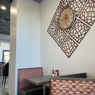 a clock on the wall of a restaurant