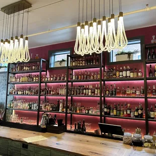 a bar with shelves of liquor