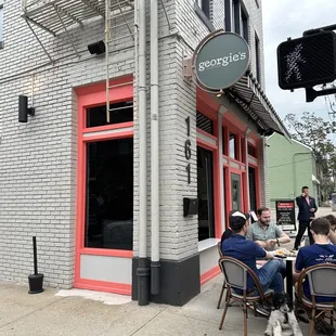 people sitting at tables outside