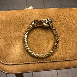 Before - a very stained purse + damage from an attempt to clean it.