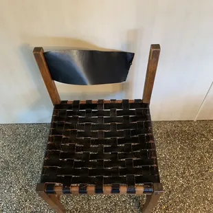 Leather chair that had broken leather back strap.