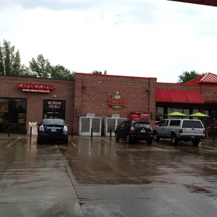 cars parked in front of a restaurant