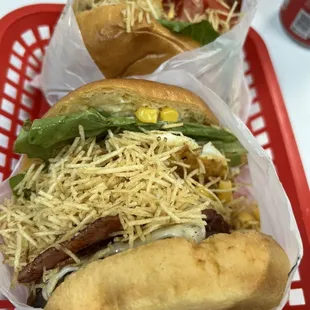 two sandwiches on a red tray