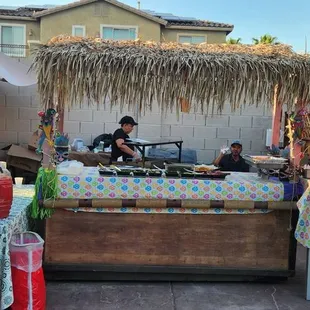 The palapa top is ours, but they brought everything else they needed!