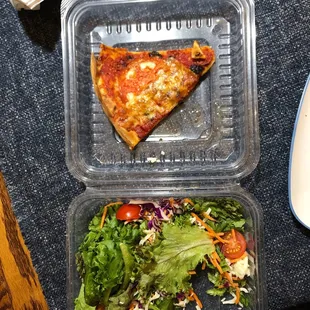a slice of pizza and a salad