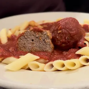 a plate of pasta and meatballs