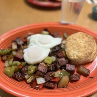 Corned beef hash with poached eggs, sub toast for biscuit (extra)