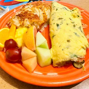 My yummy herb omelette with hash and a side of fruit.  Only complaint was that fruit wasn&apos;t as sweet and yummy.