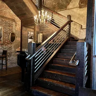 Live pianist next to a beautiful staircase