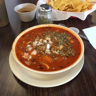 a bowl of soup and chips