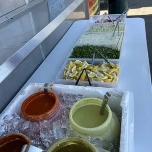 The two front salsas are the least spicy. Avocado on the right..