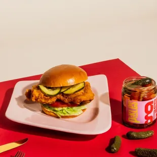 a sandwich and pickles on a plate