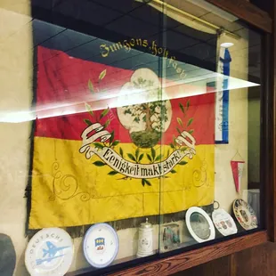 This banner commemorates 2 historic slogans of the Society: 'hold fast, lads' &amp; 'strength in unity'