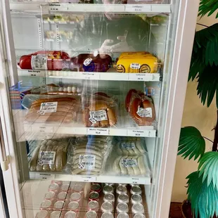 Cases of sausages and cured meats