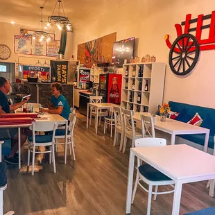 two people sitting at a table in a restaurant