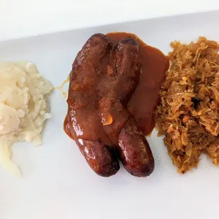 Currywurst, potato salad, and sauerkraut.