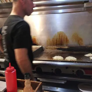 Mark keeping an eye on the Hash browns...best in the city!