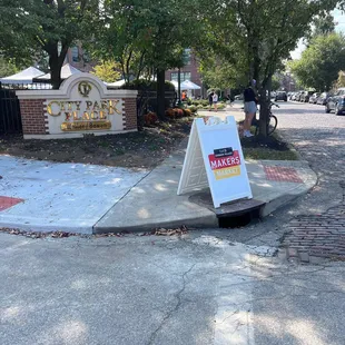 a sign on the sidewalk