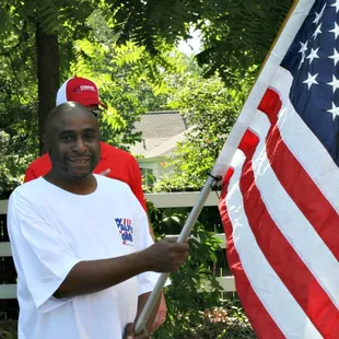 Clients of Alpha Omega Veterans Services leading horses at the Germantown Charity Horse Show with Southern Reins Center for Equine Therapy