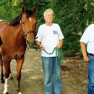 Clients of Alpha Omega Veterans Services leading horses at the Germantown Charity Horse Show with Southern Reins Center for Equine Therapy