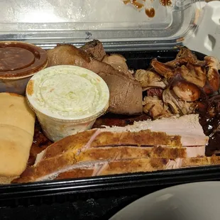 The Boss Hog Special, $31.95 + $1.50 for Brisket (prior to tax). Shown with Brisket, Pulled Pork, Chicken, Pork Ribs