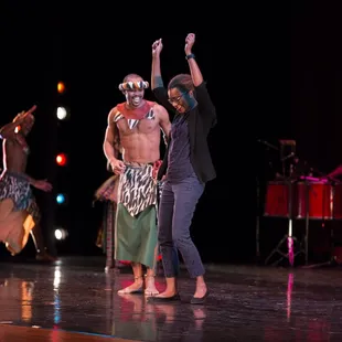Brazilian folk group with audience member on stage