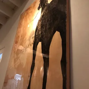 A horses ass . The beast seat in the house .