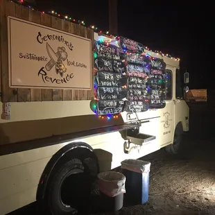 a food truck decorated with christmas lights