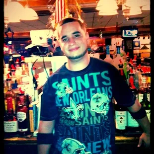 a man standing in front of a bar